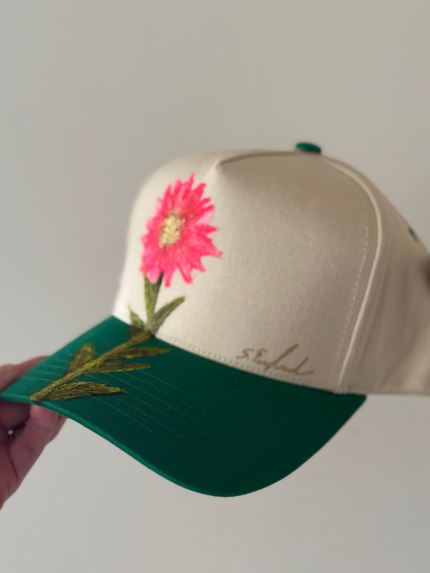 Hand painted cream and bright green trucker hat