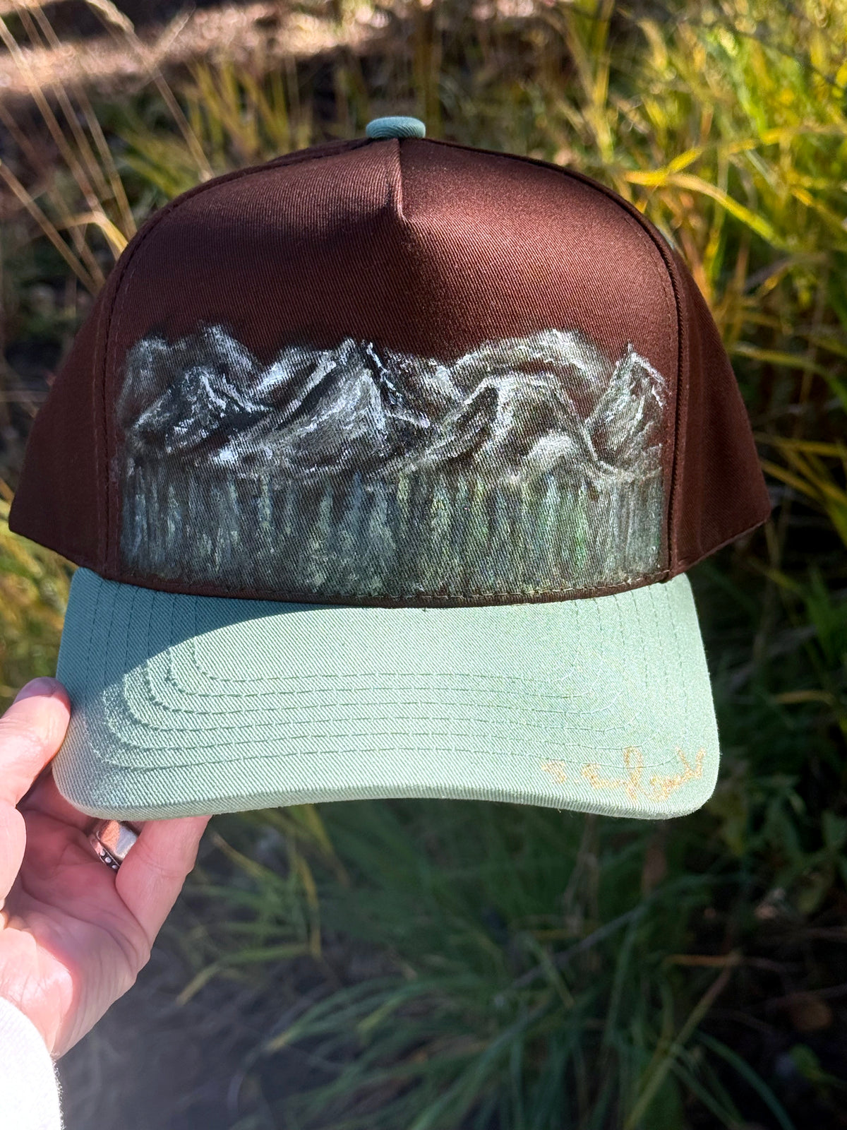 Hand painted wearable art on brown/green canvas baseball cap - mountain scenes