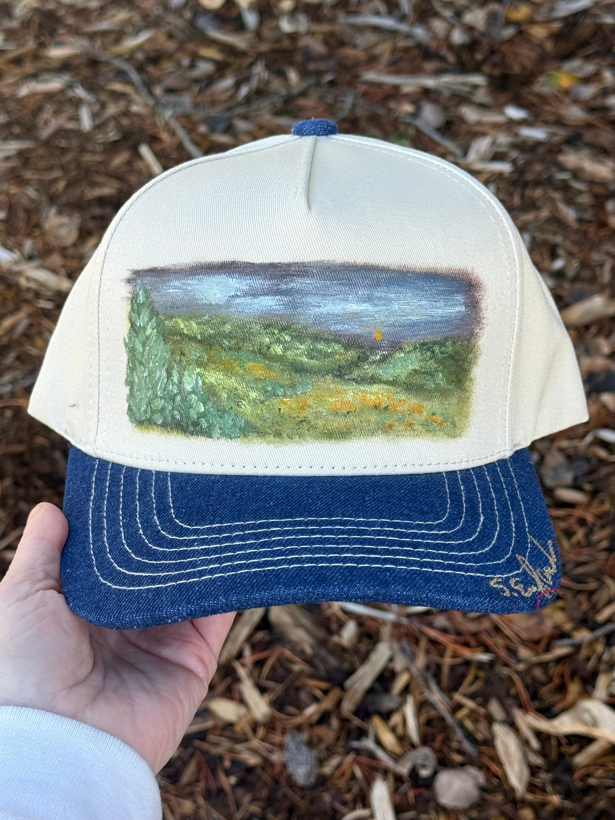 Hand painted wearable art painted on cream/denim blue baseball cap - landscape