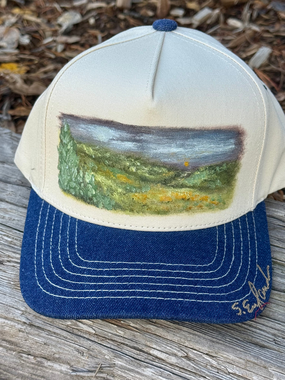 Hand painted wearable art painted on cream/denim blue baseball cap - landscape