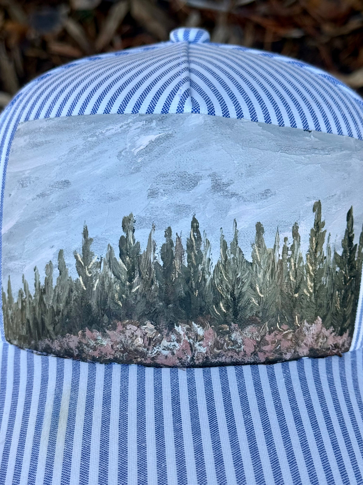 Hand painted wearable art on white and blue stripped baseball cap - tree scape