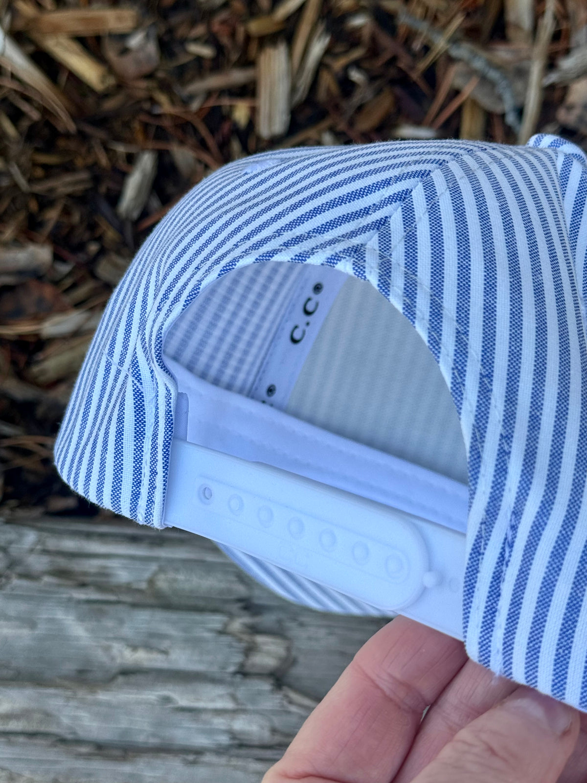 Hand painted wearable art on white and blue stripped baseball cap - tree scape