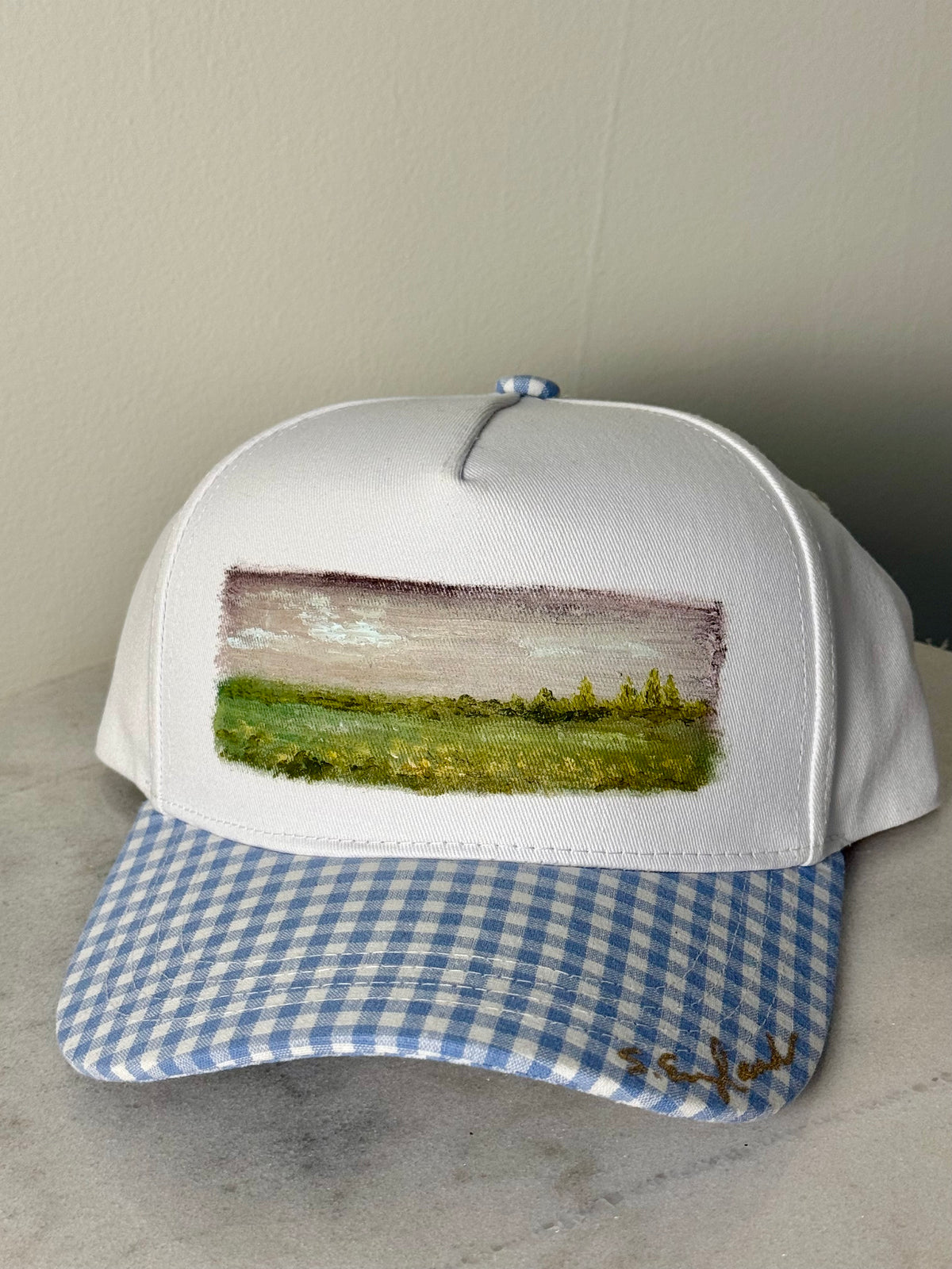Hand painted wearable art painted on white canvas hat with white and blue gingham brim -landscape