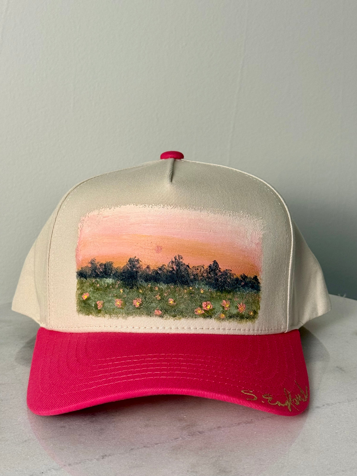 Hand painted wearable art on pink brim and tan baseball hat - pink sunset landscape