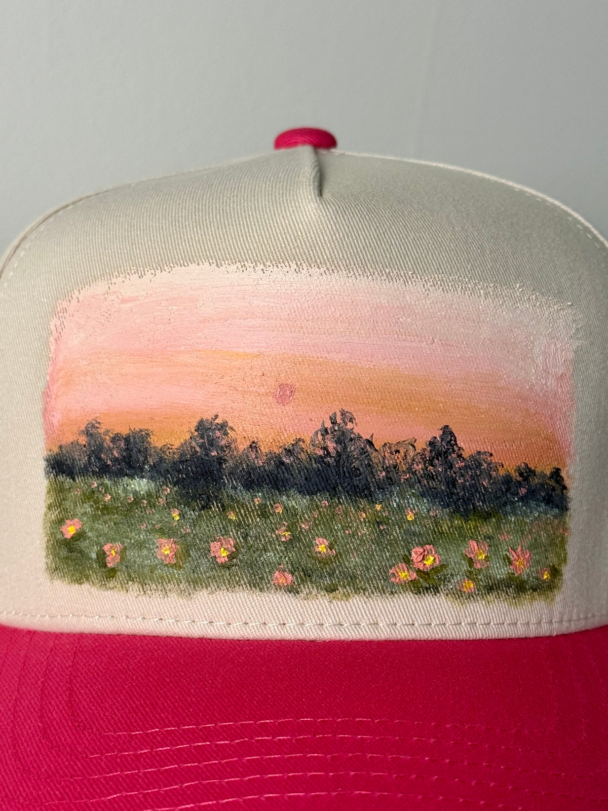 Hand painted wearable art on pink brim and tan baseball hat - pink sunset landscape