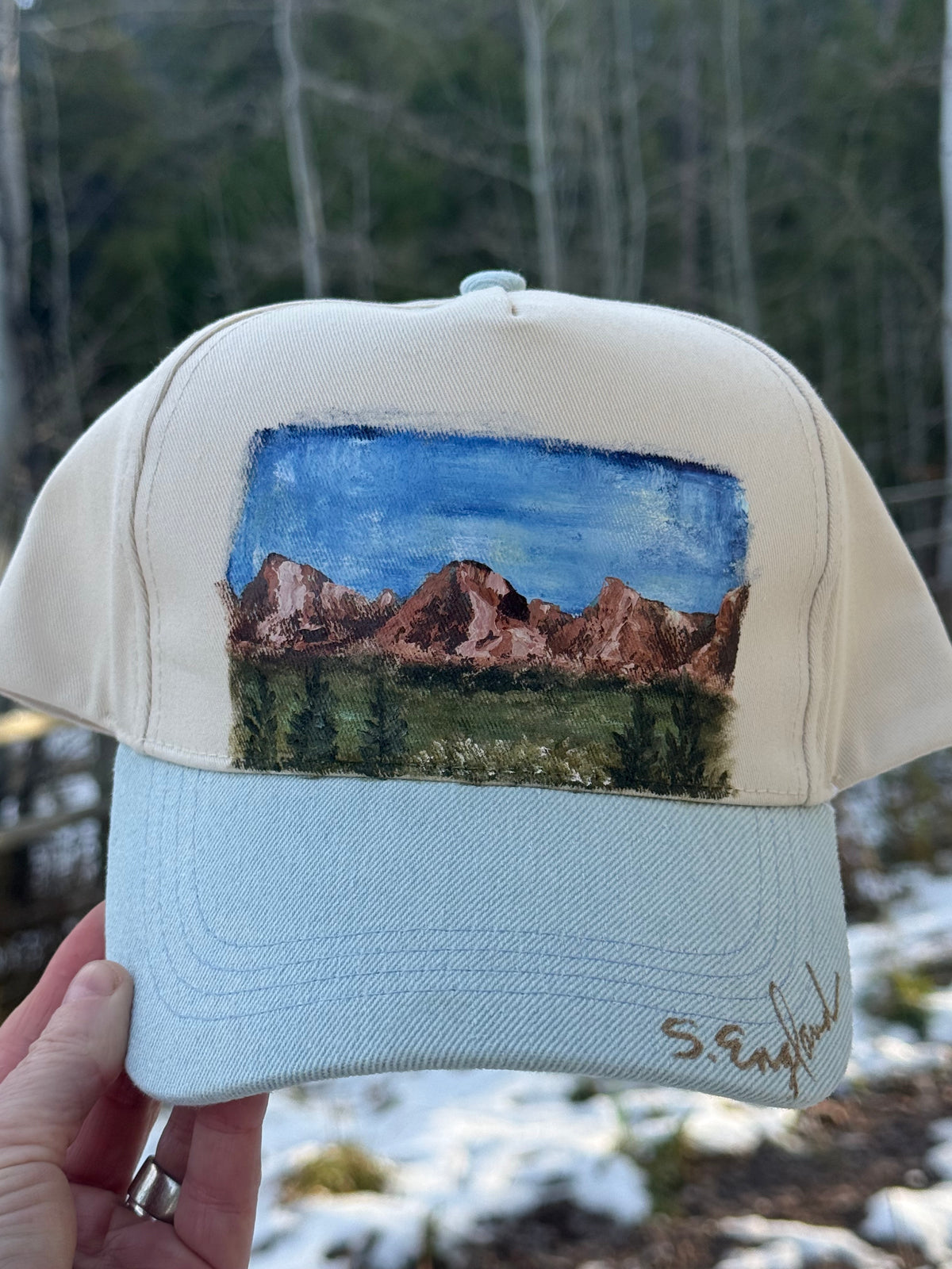 Hand painted wearable art on a soft cream and denim blue ball cap - mountain hikes