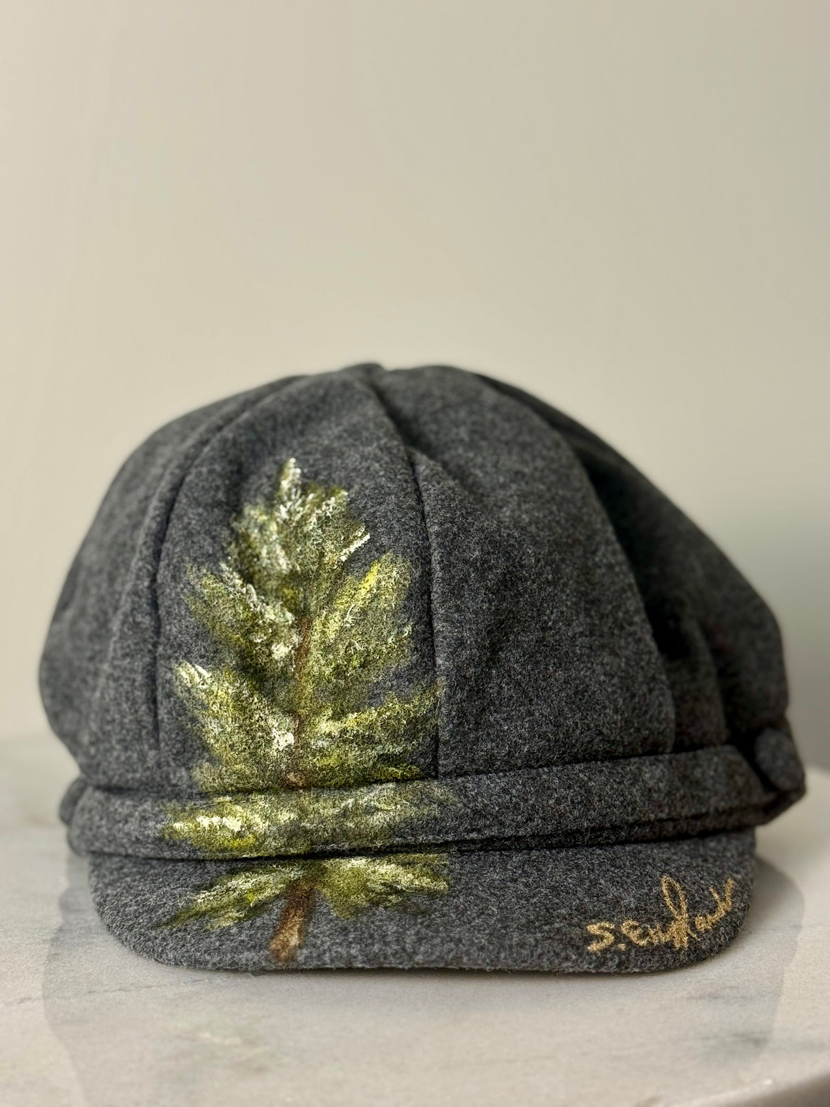 Hand painted wearable art on soft dark grey polyester newsboy cap - lone tree