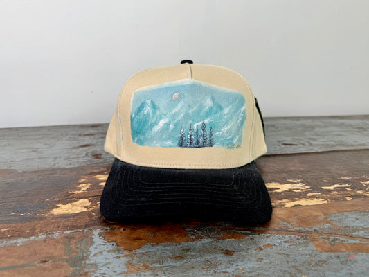 Wearable art - go to the mountains trucker hat
