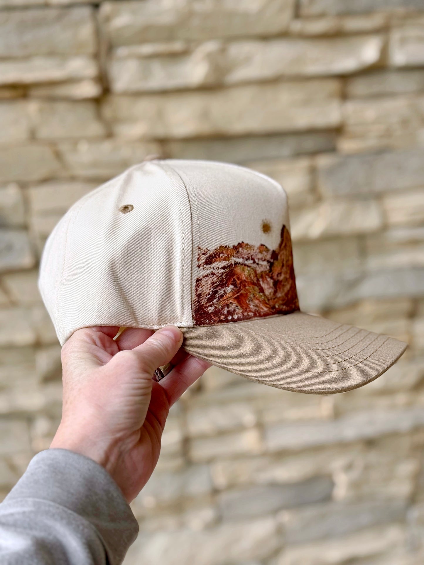 what are men to rocks and mountain hand painted canvas  CC trucker hat - cream and light brown