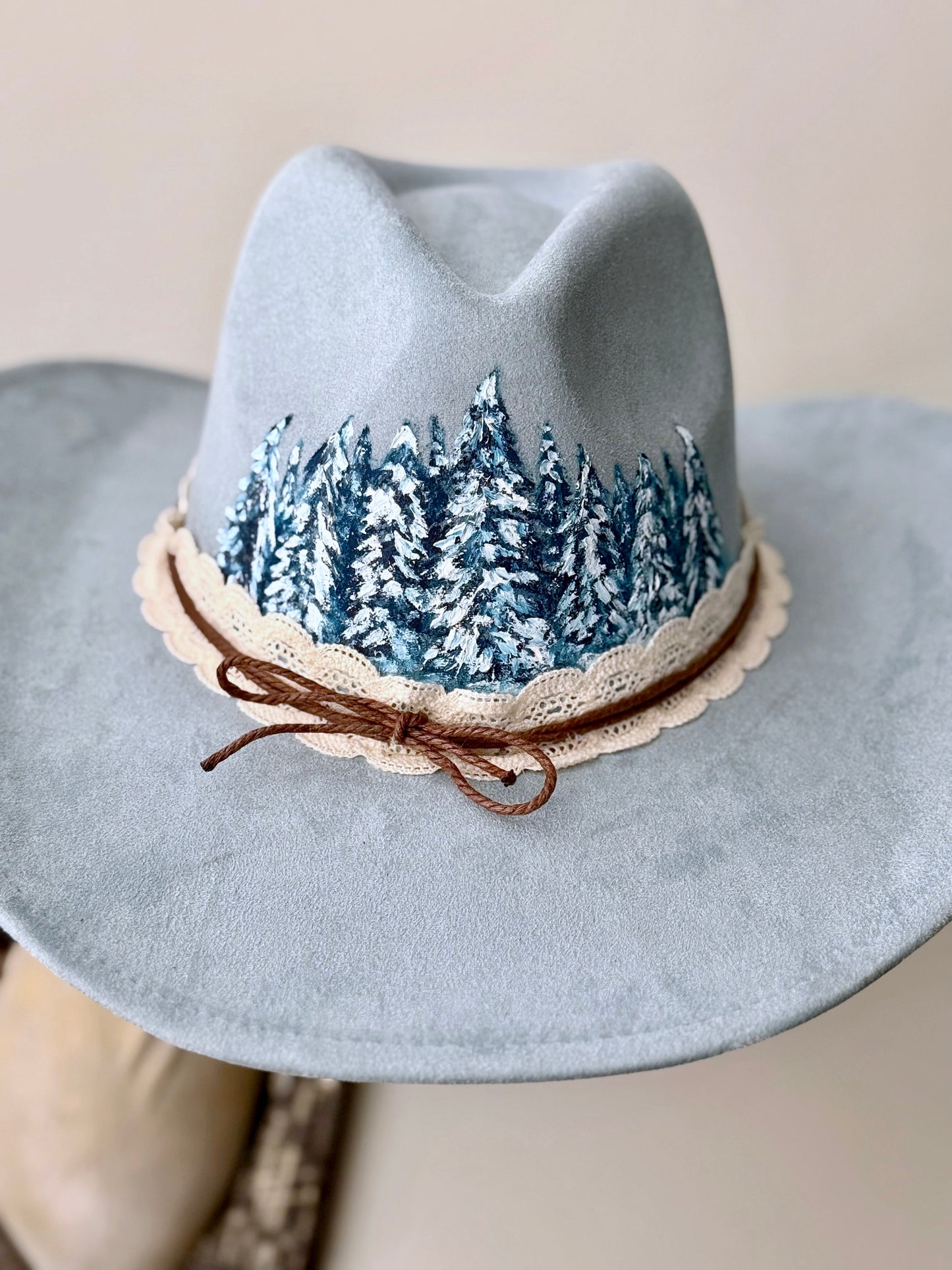 Elevate your style in this soft blue vegan suede hat - hand painted