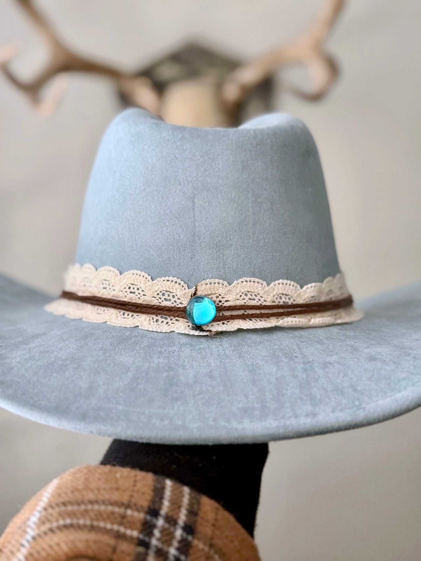 Elevate your style in this soft blue vegan suede hat - hand painted