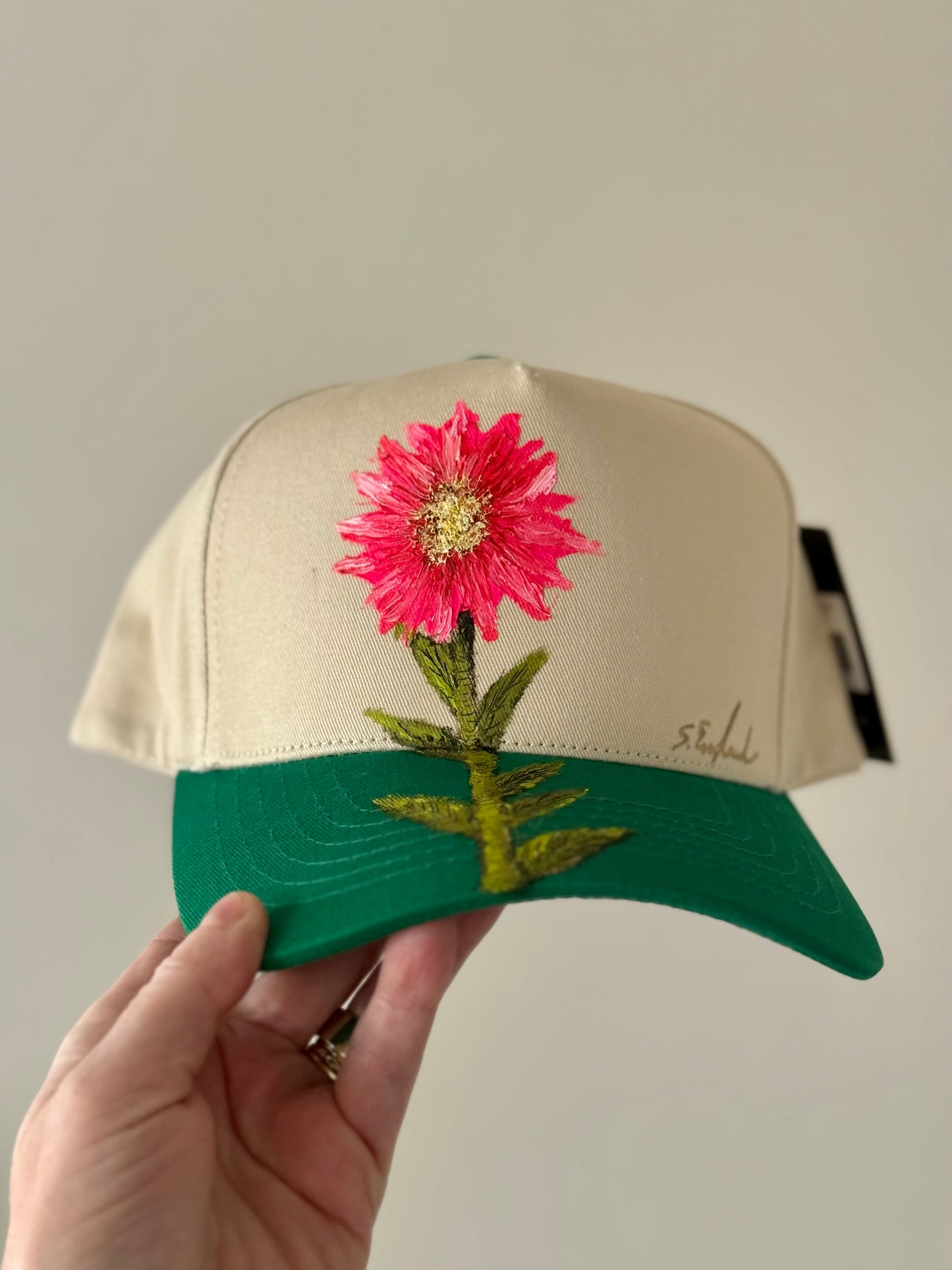 Hand painted cream and bright green trucker hat