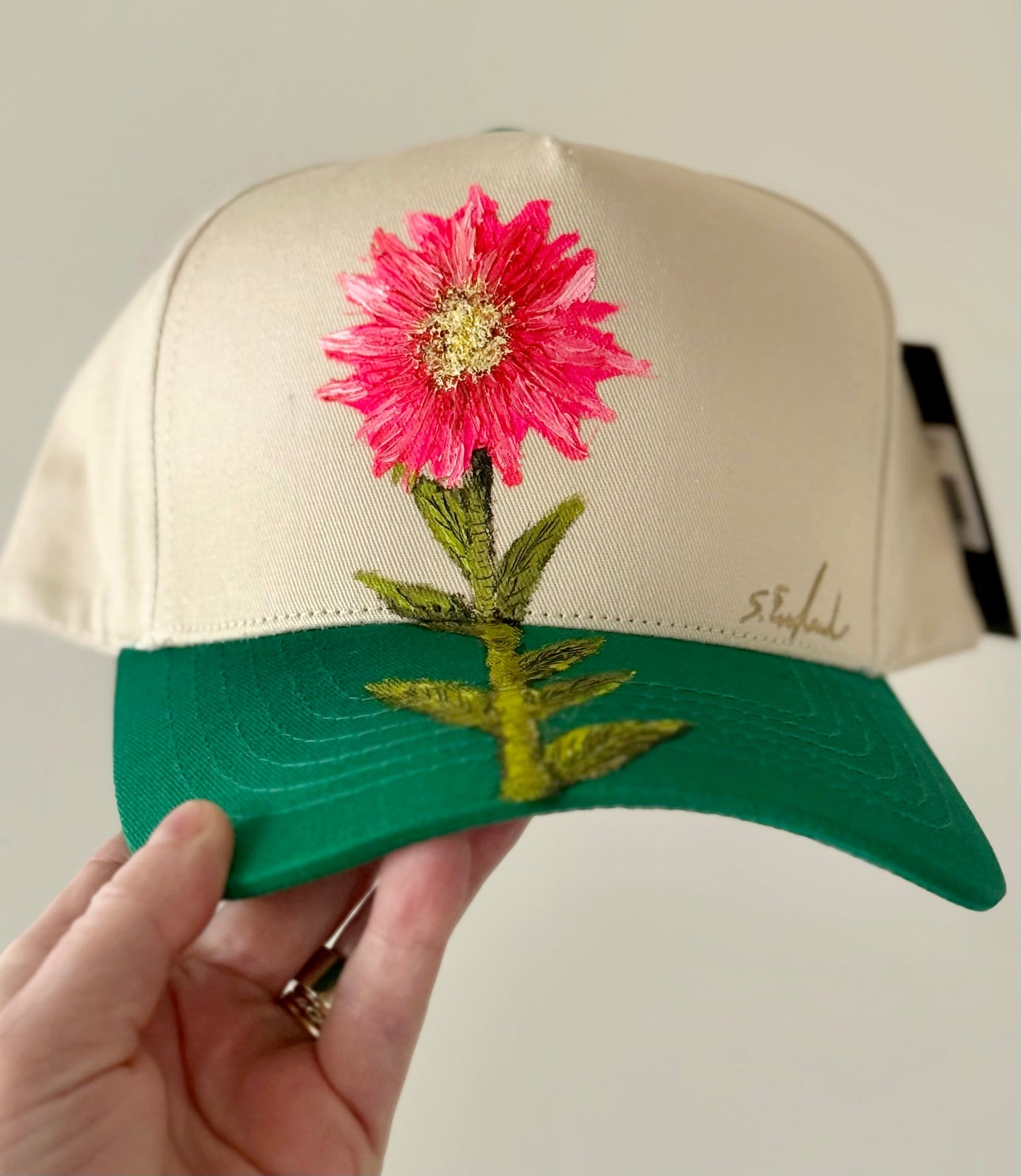 be pretty in pink in this hand painted CC cream and green trucker hat