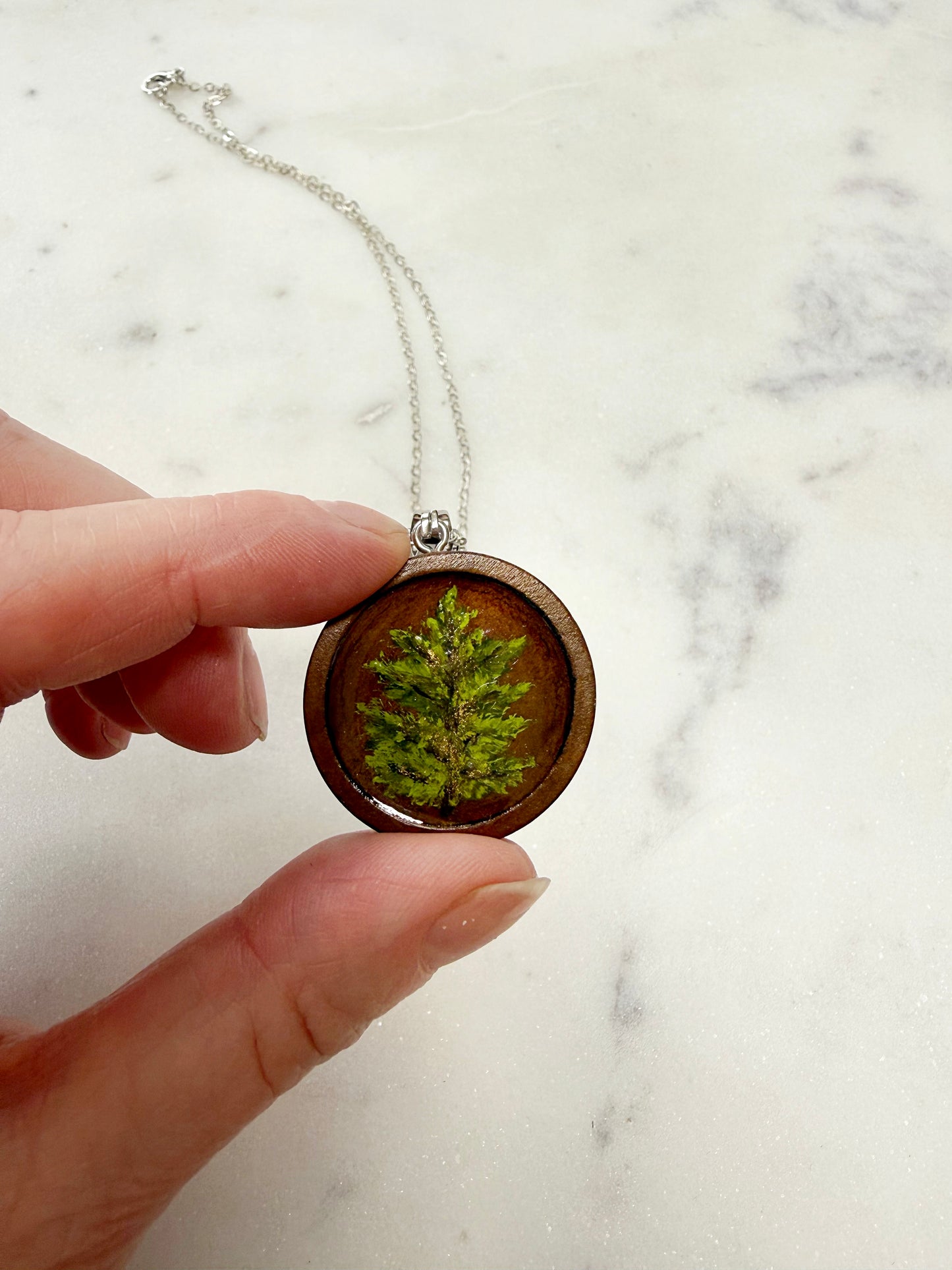 Hand painted pine tree on wood disc necklace