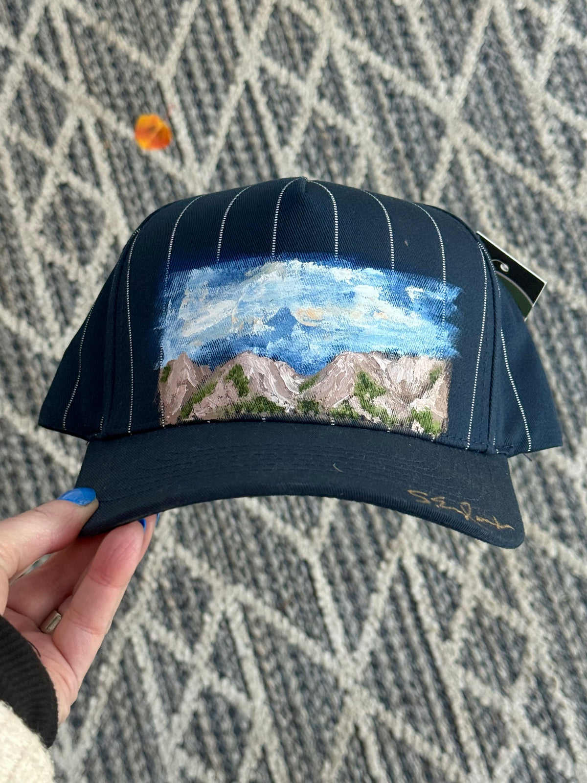 Hand painted wearable art that is washable- mountains scene on blue/white stripe ball cap