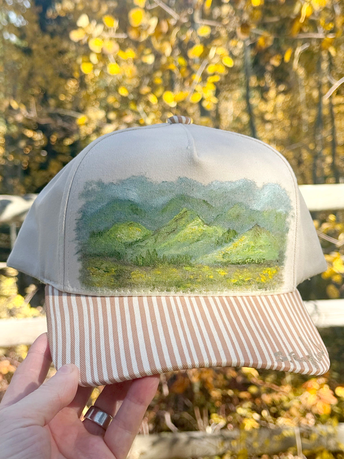 Hand painted mountain scene on cream and brown canvas hat