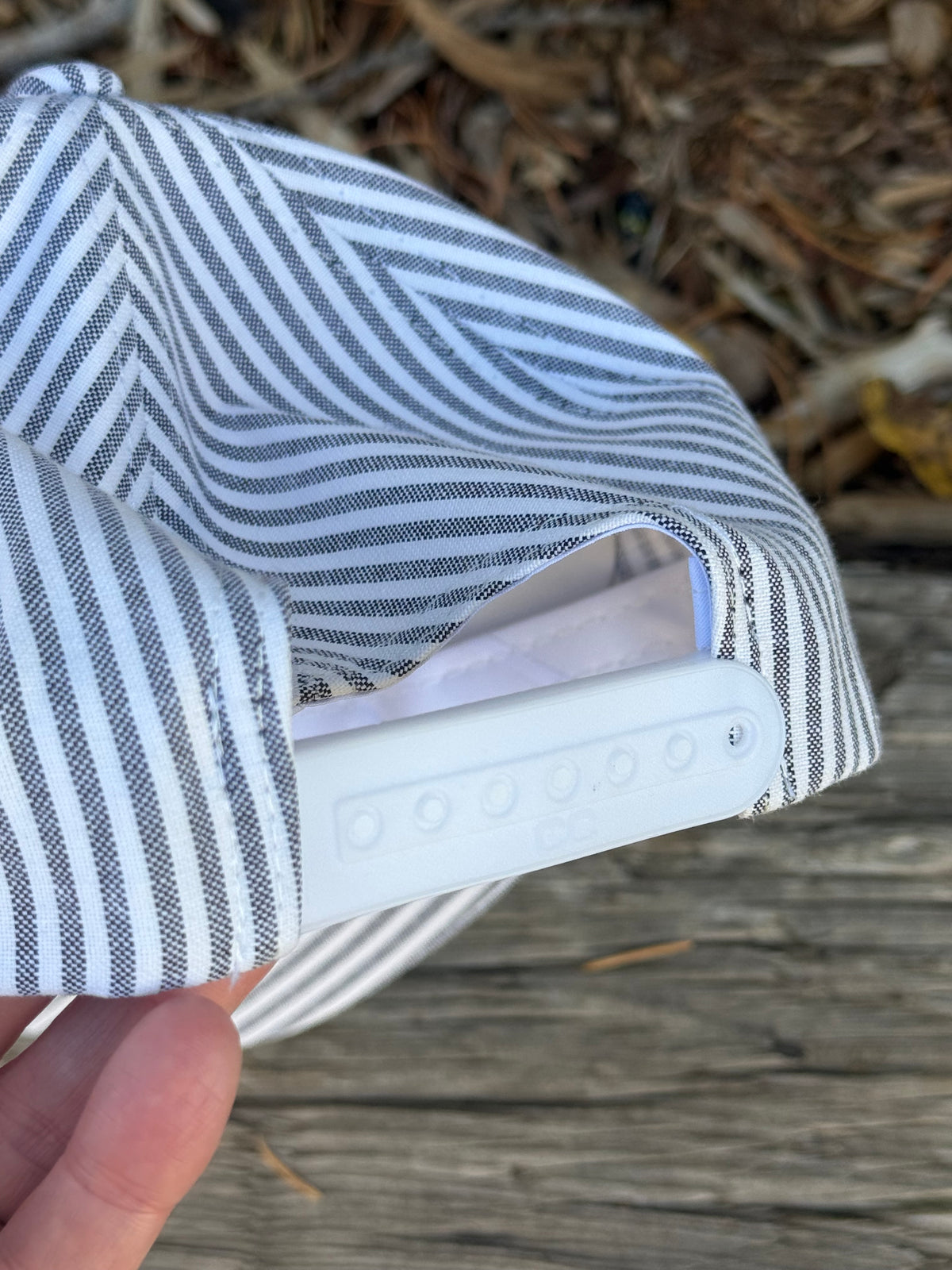 Hand painted landscape painting on blue/white stripped canvas hat