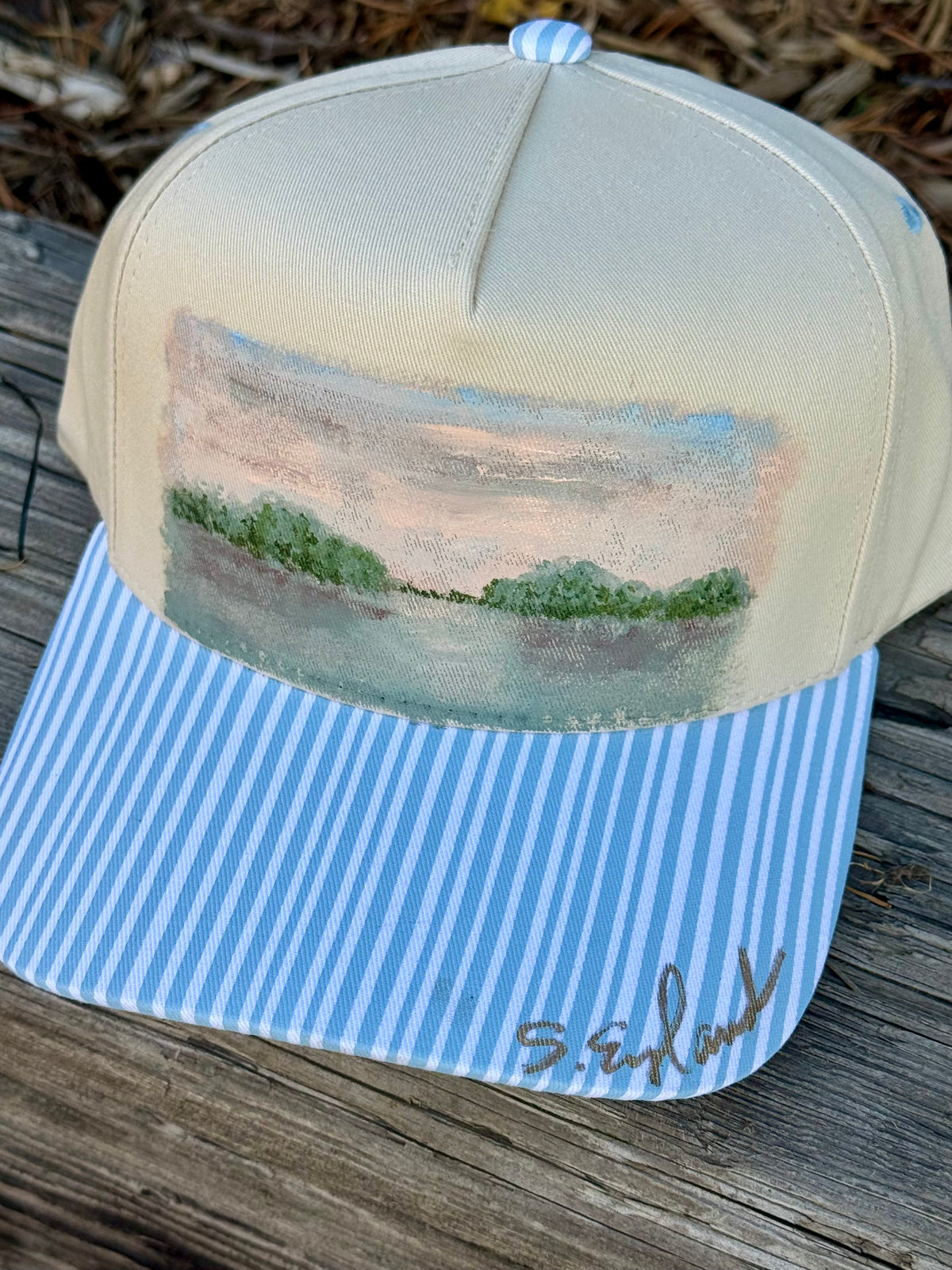 Hand painted landscape scene on cream and blue canvas hat