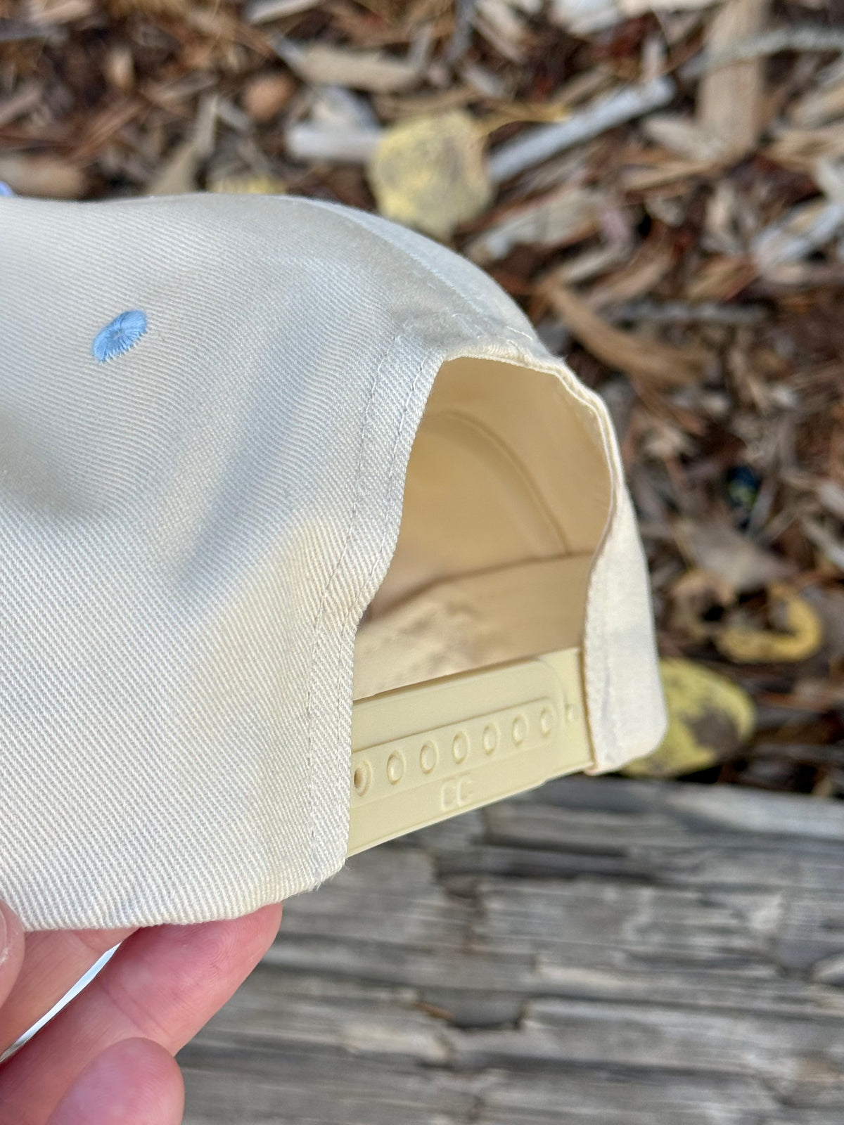Hand painted landscape scene on cream and blue canvas hat