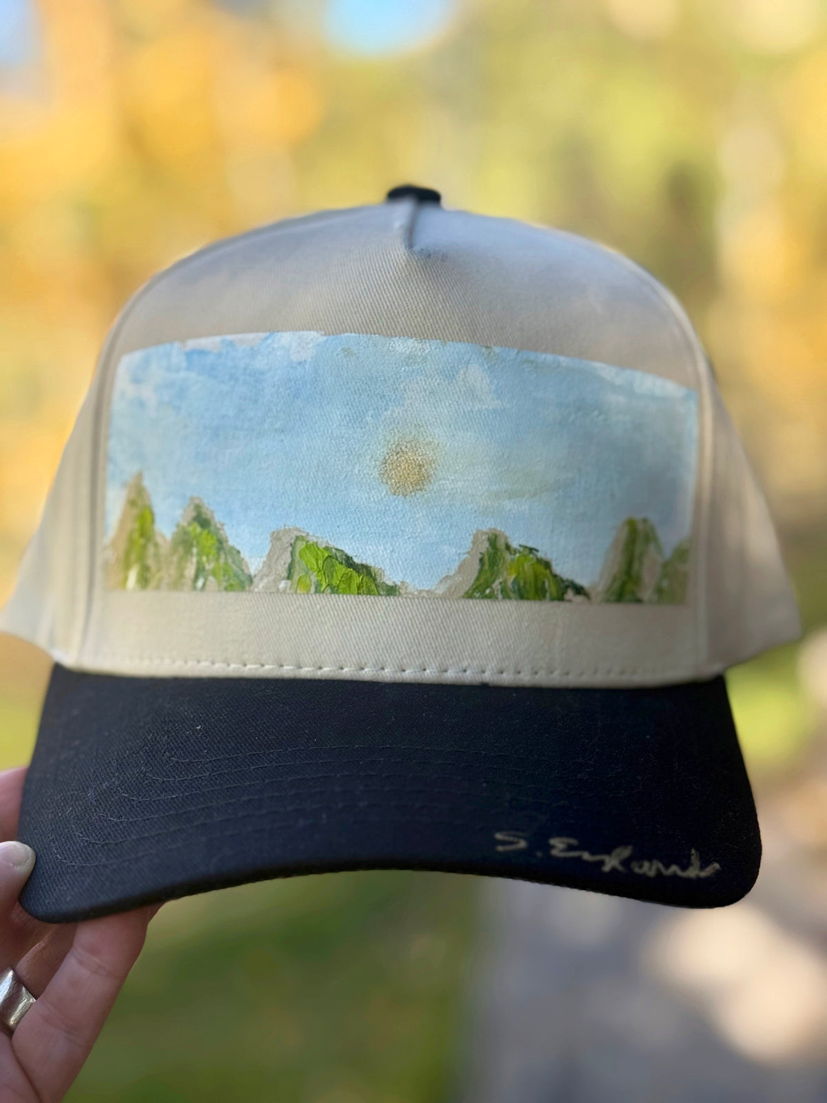 Hand painted contemporary mountain scene on black/cream canvas hat