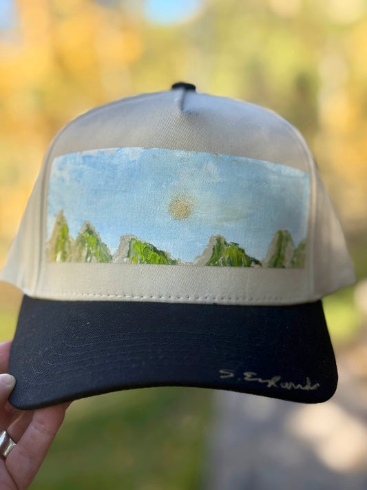 Hand painted contemporary mountain scene on black/cream canvas hat