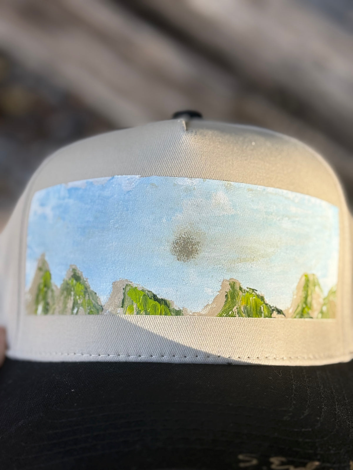 Hand painted contemporary mountain scene on black/cream canvas hat