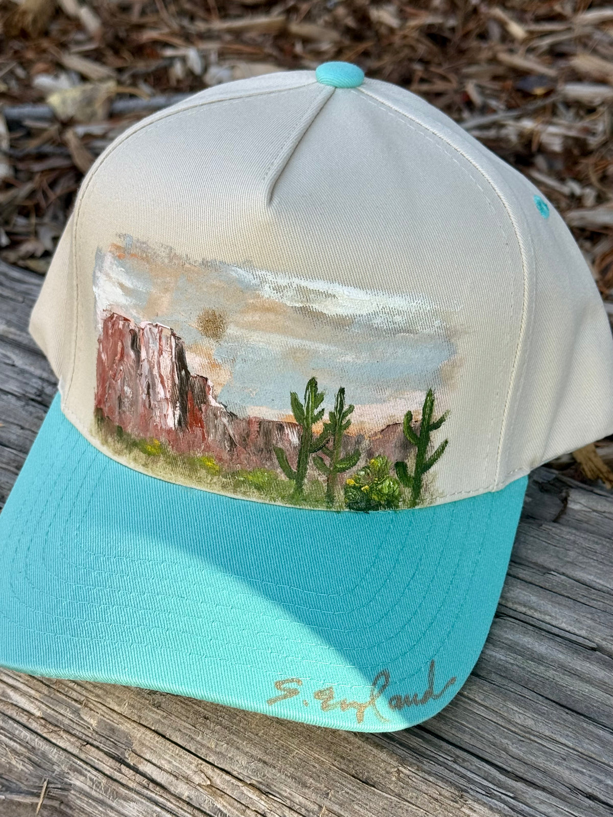 Hand painted desert landscape painted on cream/teal baseball cap